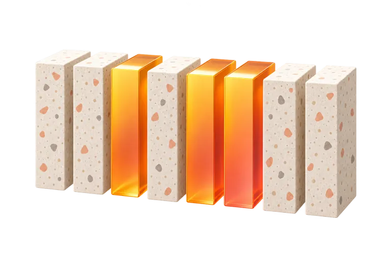Ein Terrazzoblock, in gleich große Scheiben geteilt, einige davon aus glänzendem orangem Acryl
